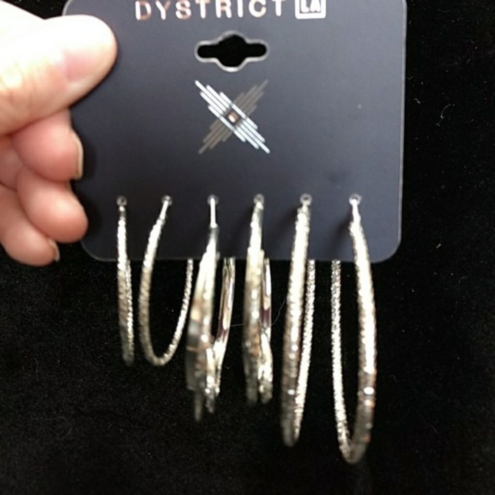 Dystrict LA silver tone hoop earrings set three pairs